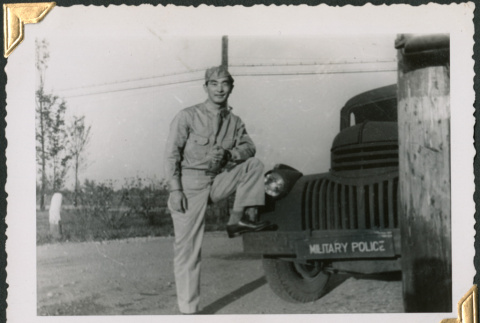 Man standing by Military Police truck (ddr-densho-434-372)