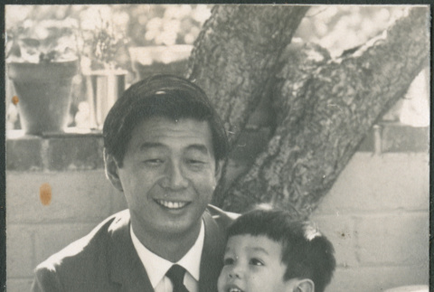 Man holding toddler (ddr-densho-523-405)