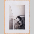Photo of a baby in a corner (ddr-densho-483-488)