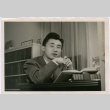 Frank Watanabe studying (ddr-densho-488-12)