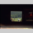 William Kochiyama and Robert H. Foote walking through a Cornell university barn and driving around (ddr-densho-1007-1520)