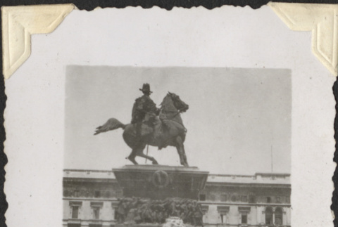 Man sitting on edge monument to Vittorio Emanuele II in Milan (ddr-densho-466-776)