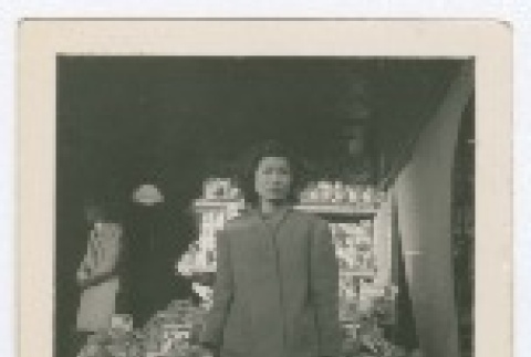 (Photograph) - Image of woman standing in front of fruit stand (PDF) (ddr-densho-332-2-mezzanine-7a1e01c23a)