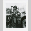 U.S. soldier leaning against car (ddr-densho-1007-354)