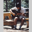 Craig So playing guitar (ddr-densho-336-1489)