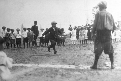 Children playing a game at a community picnic (ddr-densho-13-10)