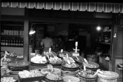 Store with bins of produce in front (ddr-densho-426-2348)