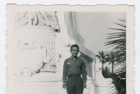 Soldier standing in front of statue (ddr-densho-368-156)