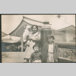 Woman with three children (ddr-densho-293-128)
