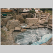 Hot tub with rock landscaping (ddr-densho-377-1963)