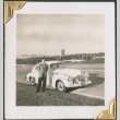 Man standing next to car on side of road (ddr-densho-434-138)