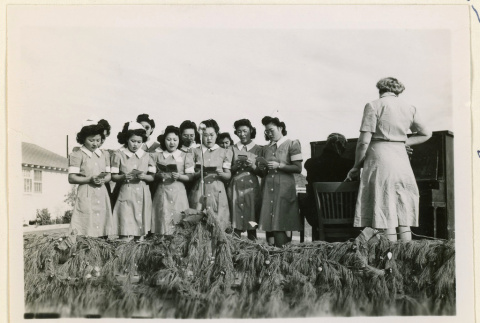 Christmas choir at a hospital tea party (ddr-densho-37-1251)