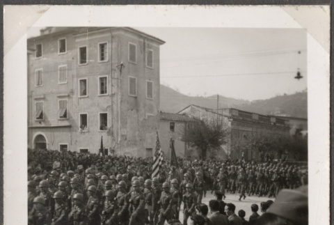 Men marching in formation with civilians watching (ddr-densho-466-61)