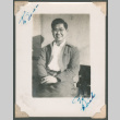 Dick Matsuhira sitting on a bench (ddr-densho-463-53)