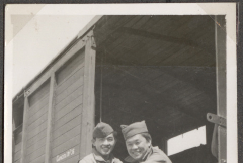 Two men sitting in boxcar (ddr-densho-466-97)