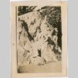 Woman seated on rocks (ddr-densho-423-559)