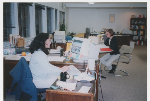 Becky Fukuda and other staff member working in Densho basement office (ddr-densho-506-75)
