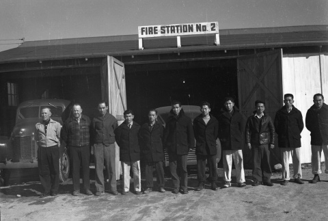 Firemen standing in front of Fire Station No. 2 (ddr-fom-1-763)