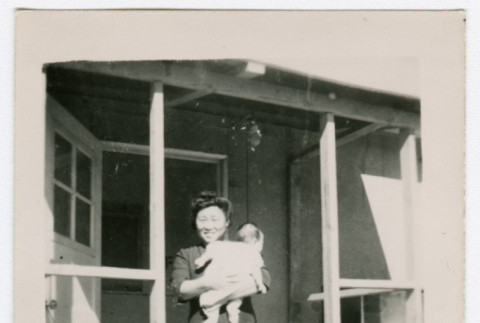Woman and baby outside a barrack (ddr-densho-356-113)