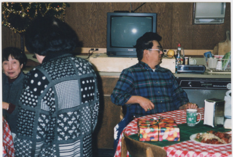 Groups around tables, Martha Suzuki with back to camera (ddr-densho-426-1303)