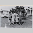 Three women and a man outside house (ddr-densho-522-60)