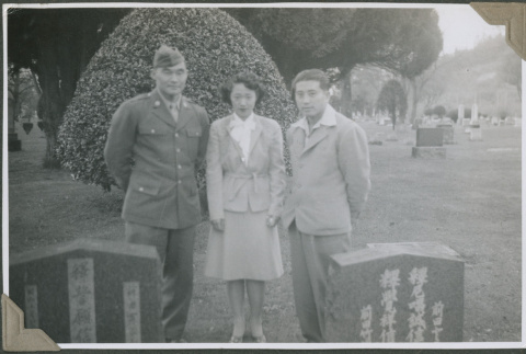Matsuo Sakagami, Pearl Hikida, and Frank Mayeda in a cemetery (ddr-densho-201-861)