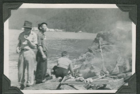 3 men roasting chickens (ddr-densho-540-66)