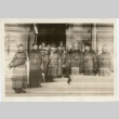 A group of men standing outside a building (ddr-njpa-6-7)