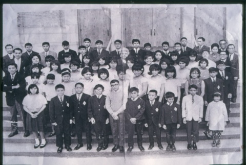 Group of boys and girls standing on steps of building (Maryknoll school) (ddr-densho-330-217)