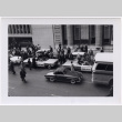 Black and white photo of cars in parade (ddr-densho-426-13)