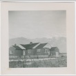 View of a house with mountains in the distance (ddr-densho-338-289)