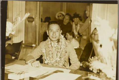 Juichi Doi sitting at a desk (ddr-njpa-5-432)