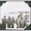 Group of smiling men walking in snow (ddr-ajah-2-452)