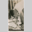 Man working with hammer (ddr-densho-426-1021)