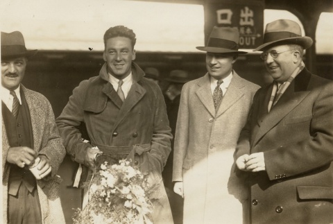 Four men standing outside (ddr-njpa-1-1002)