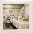 Four men sitting at a table with plates of food (ddr-densho-426-1935)