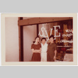Three women standing in front of window display (ddr-densho-426-834)