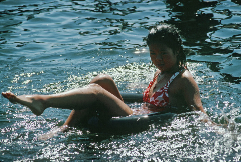 Andrea Tong floating on the lake (ddr-densho-336-1143)