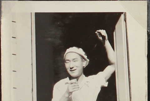 Young Nisei man laughing (ddr-densho-259-473)