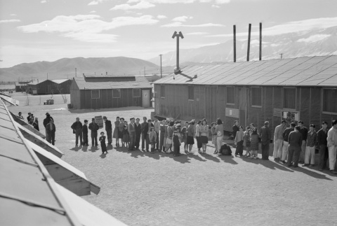 Japanese Americans lining up for mess hall (ddr-densho-93-21)