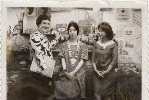 Three women standing by shelves (ddr-densho-426-377)