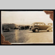Automobiles parked on a dirt field (ddr-densho-404-24)