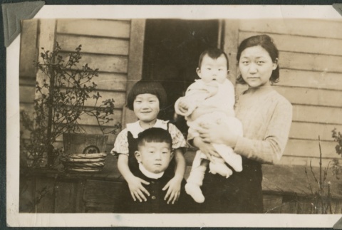A woman with three children (ddr-densho-321-744)