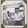 Gary Kikawa by a music display (ddr-densho-542-98)