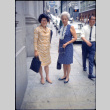 Martha (Nozawa) Tsuchida and unknown woman standing on sidewalk (ddr-densho-426-742)