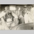 Franklin D. Roosevelt and others sitting in a car wearing leis (ddr-njpa-1-1639)
