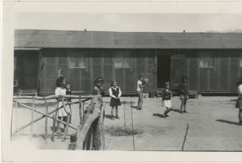 Children playing in front of barracks (ddr-manz-7-4)