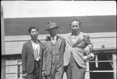 Henri Takahashi on right, with two unknown men on board ship (ddr-densho-426-1984)