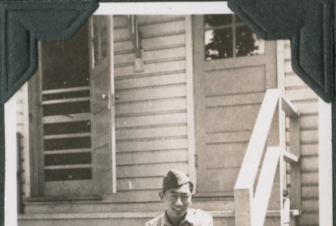 Joe Iwataki sitting on steps (ddr-ajah-2-413)