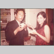 Couple eating cake (ddr-densho-523-525)